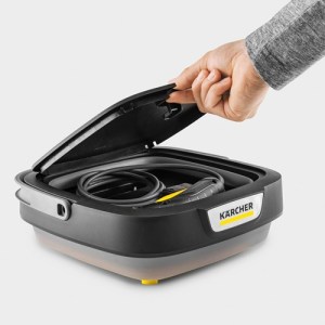 A Karcher OC3 Foldable Portable Cleaner folded down with its hose folded away inside the lid to show how compact it is to store