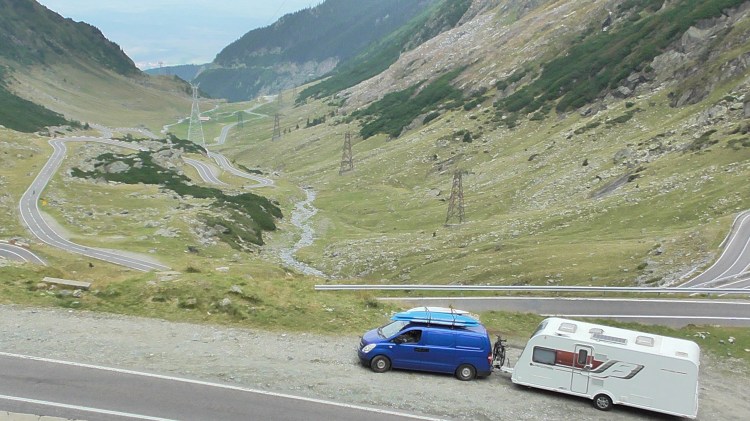 Jacqueline Lambert's van, Big Blue, towing Caravan Kismet on the hairpins of the Transfagarasan, Romania's second highest mountain pass
