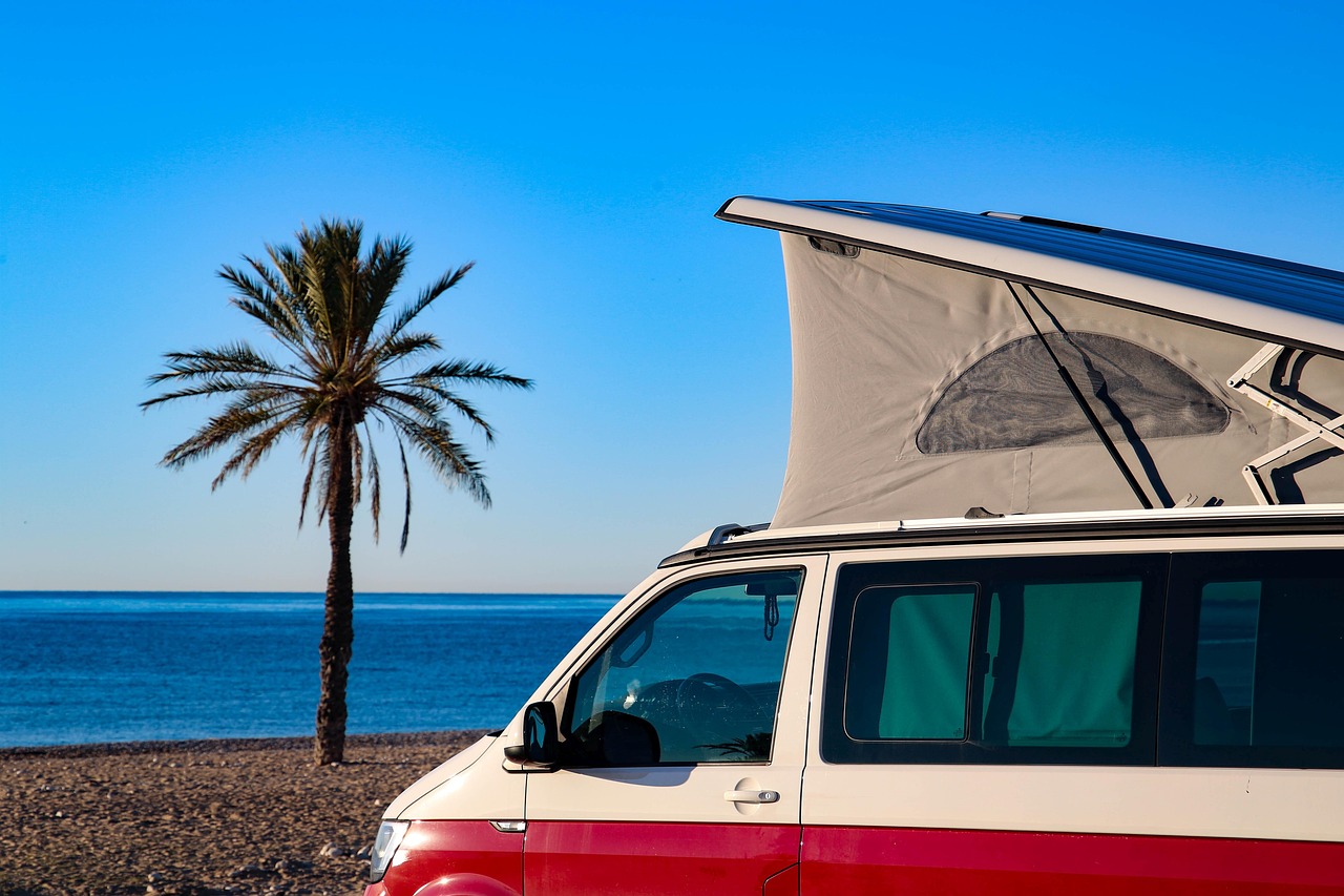 Camper in a hot tropical seeting with beach & palm tree
