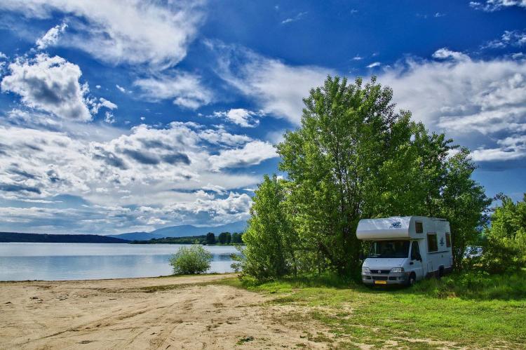 Motorhome parked in shade and by water to keep cool