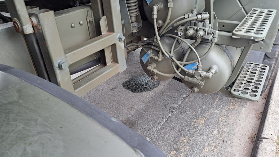 An unwelcome pool of water underneath our truck The Beast on MOT day