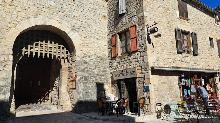 Portcullissed gate through the wall into the walled medieval town of Sévérac-le-Château 