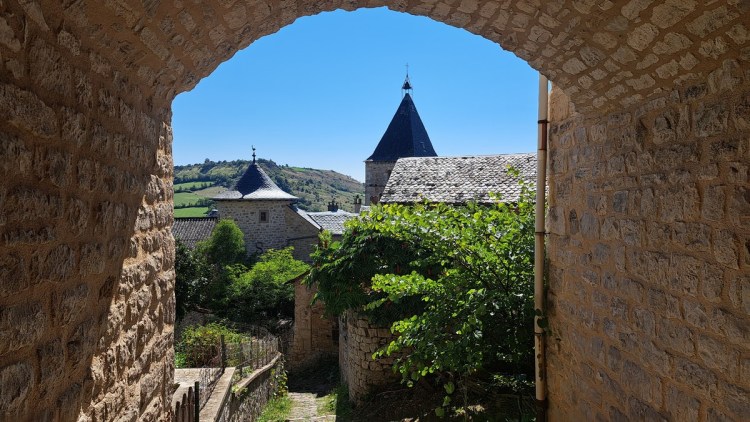 View Sévérac-le-Château through an arch