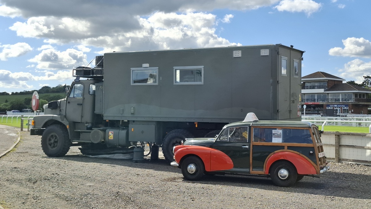 Jacqueline Lambert's truck The Beast with Jim Morrisvan the red and green Bomb Sisposal Morris Traveller on show at the Adventure Overland Show